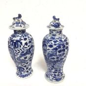 A pair of Chinese 1900/20s baluster vases decorated with four claw dragon, complete with covers,
