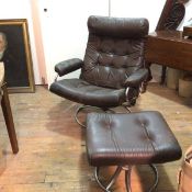 A Norwegian 1960s chrome recliner easy chair upholstered in brown leather, with button back and