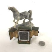 An chromium plated 1930s alarm clock with black luminous dial, complete with travelling case,