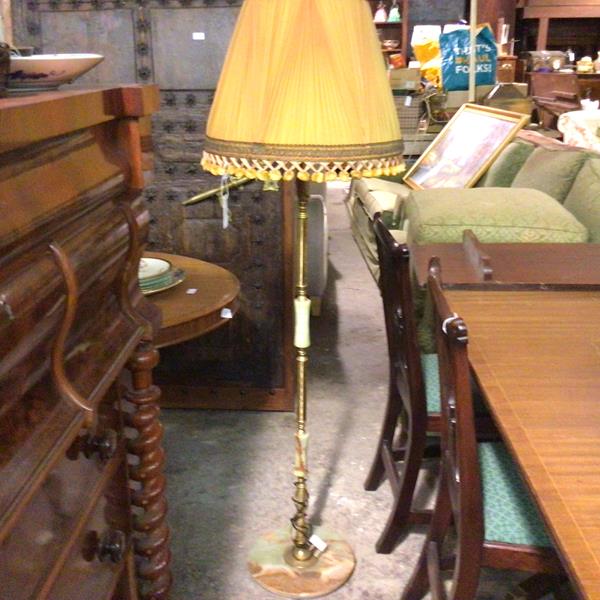 A mid century onyx and brass panelled floor lamp on circular onyx base, complete with original