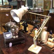 A 1950s cream enamelled anglepoise lamp, raised on stepped base (extended: 95cm base: 15cm)