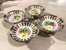 A set of four 19thc dessert service comports decorated with handpainted floral sprays, enclosed
