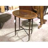An Edwardian mahogany oval inlaid occasional table raised on square tapered splay supports united by