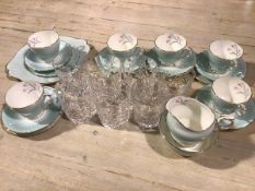 A group of seven crystal slice cut tumblers, a Paragon china twenty piece tea service decorated with