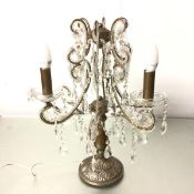 A Continental white and gilt metal three branch baluster stem table candelabra table lamp with