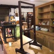 A 19thc adjustable mahogany screen, the rectangular frame (missing centre panel), raised on square