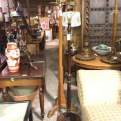 A modern mahogany fluted turned wood floor lamp and a stained pine upright triangular stepped