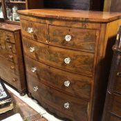 A Victorian mahogany bow front chest, the top with moulded edge above two short and three