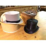 A leather hat box containing a gentleman's M.D. Dunlop & Co., Edinburgh silk top hat (inside front