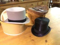 A leather hat box containing a gentleman's M.D. Dunlop & Co., Edinburgh silk top hat (inside front