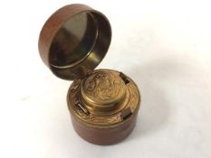 A leather covered brass inset travelling inkwell (4.5cm x 5cm)