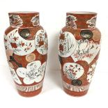 A pair of Japanese Kutani baluster vases decorated with traditional bird, fan and symbol design (