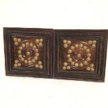 Two Malaysian hardwood inset and beaded bordered panels with brass studded decoration (32cm x 32cm)