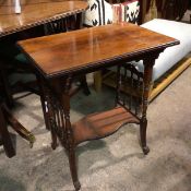 An Edwardian rosewood two tier occasional table, the rectangular top with moulded edge raised on