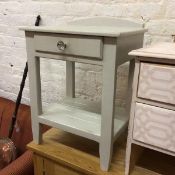 A ledgeback bedside table, the rectangular top above a single frieze drawer, on square supports