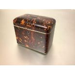 An early 19th century tortoiseshell veneered tea caddy, of plain rectangular form, with domed cover,