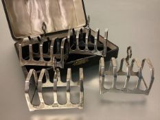 A cased set of four George V silver toast racks, Sheffield 1935, each of four divisions. (4) Each c.