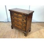 A George II style walnut bachelor's chest, first half of the 20th century, the hinged rectangular