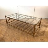 A modern birch coffee table by William Yeoward, the rectangular glass top on a conforming frame