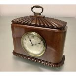 A French walnut-cased mantel clock, early 20th century, of caddy form, the case with domed reeded