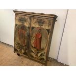 A late 18th century Continental painted hanging wall cabinet, the projecting top above a pair of