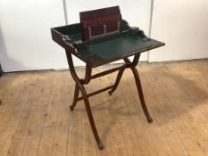 An Edwardian mahogany travelling desk, the hinged rectangular top enclosing a fitted interior