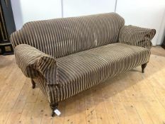 A Victorian mahogany sofa, the shaped back and outswept arms upholstered in striped fabric, on