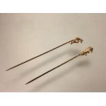 Two single stone diamond stick pins, c. 1900, each mounted in yellow metal (unmarked) as a claw