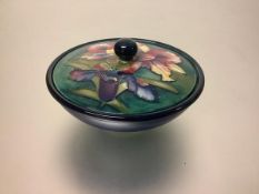 A William Moorcroft Iris pattern powder bowl, the cover tubelined and painted against a shaded
