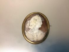 A large 19th century carved shell cameo brooch, depicting Eos, Goddess of the Dawn, in an unmarked