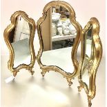 An Italian giltwood triptych dressing table mirror, each cartouche-shaped plate within a