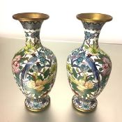 A pair of striking Japanese cloisonne enamel vases, of baluster form, each polychrome decorated with