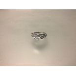 A single stone diamond ring, the round brilliant-cut stone weighing approx. 1ct, claw set on an