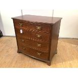 A 19th century mahogany and boxwood-strung bowfront chest, with two short and three long drawers,