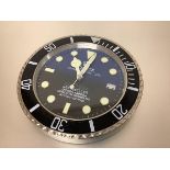 A Rolex advertising wall clock, "Deep Sea Sea-Dweller", battery operated. Diameter 34cm