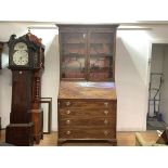 A Scottish George III mahogany bureau bookcase, the moulded projecting cornice above a pair of