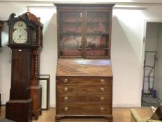 A Scottish George III mahogany bureau bookcase, the moulded projecting cornice above a pair of