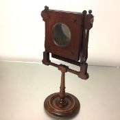 A George III mahogany zograscope, of characteristic form, with spherical finials, turned baluster