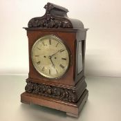 A late 19th century carved oak cased bracket clock, the silvered 7 1/2" dial signed "Hugh Connell,
