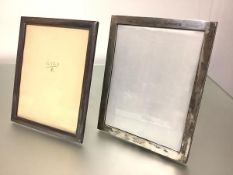 Two large plain rectangular silver photograph frames, one stamped "Silver 970", the other "Silver