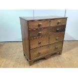 A George III elm country chest, the rectangular top with reeded edge above four long drawers, and