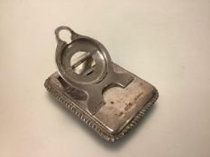 An unusual Edwardian silver combination watch stand and desk correspondence clip, Grey & Co., London