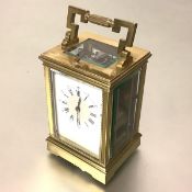 A French 19th century brass-cased repeater carriage clock, the eight day movement striking the
