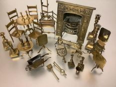A collection of miniature brass furniture, including a fireplace, fender and tools, set of four