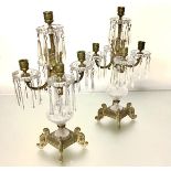 A handsome pair of gilt-metal and cut-glass five-light lustre candelabra, early 20th century, the
