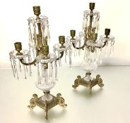 A handsome pair of gilt-metal and cut-glass five-light lustre candelabra, early 20th century, the