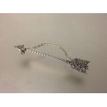 A diamond-set jabot pin, early 20th century, modelled as an arrow, set with thirteen old brilliant-