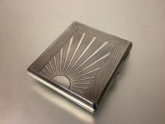 A George V silver cigarette case in the Art Deco taste, Herbert Bushell & Son, Birmingham 1931, of