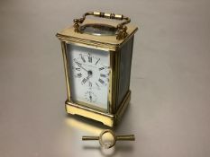 A French 19th century brass-cased alarm carriage clock, by Margaine, Paris, the white enamel dial