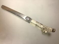 A 19th century Japanese Meiji period carved ivory-handled silver-plated page turner, the handle
